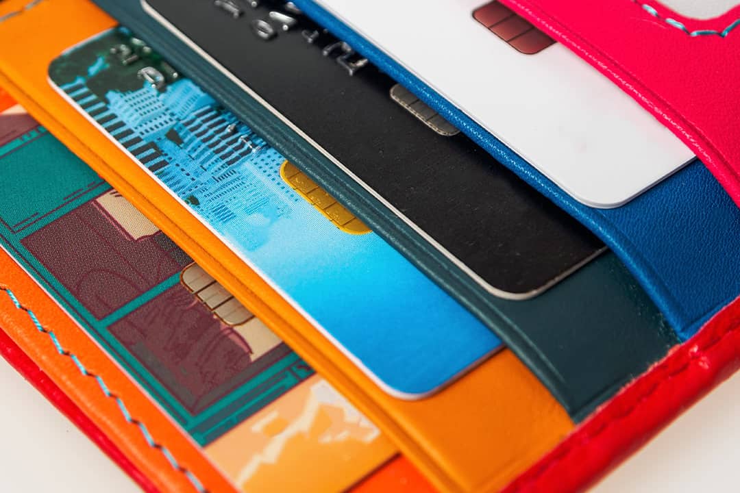 A collection of credit cards inside a wallet.